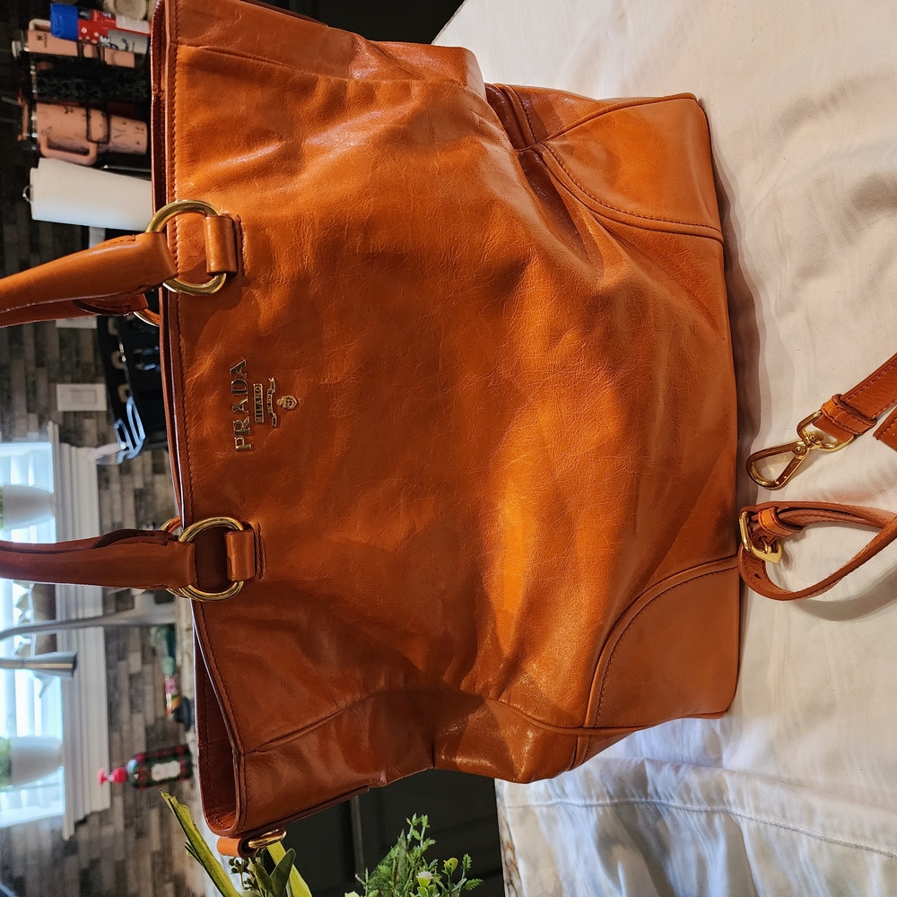 Prada Orange Satchel with High-Quality Leather and Spacious Design
